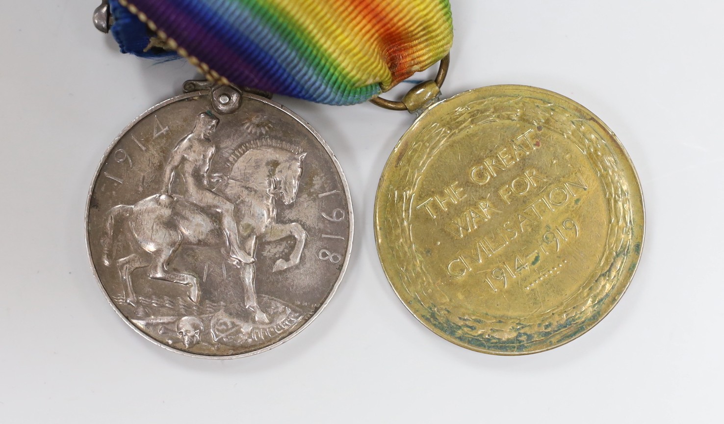A WWI and WWII Special Constabulary group to PTE. G. HARRINGTON R. SUSSEX R and Special Constabulary for Faithful Service in Brighton Special Constabulary and WWII Defence Medal with silver and enamel masonic medal